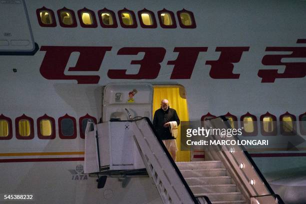 Indian Prime Minister Narendra Modi disembarks from his plane on July 7, 2016 at the Waterkloof Air Force Base in Pretoria. - Indian Prime Minister...