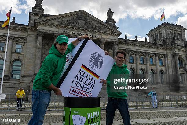 Activists of the association for the environment and nature conservancy protest under the motto 'climate killer law...chuck it in the dustbin' in...