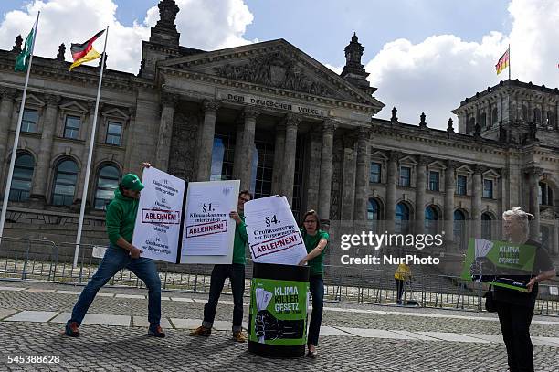 Activists of the association for the environment and nature conservancy protest under the motto 'climate killer law...chuck it in the dustbin' in...