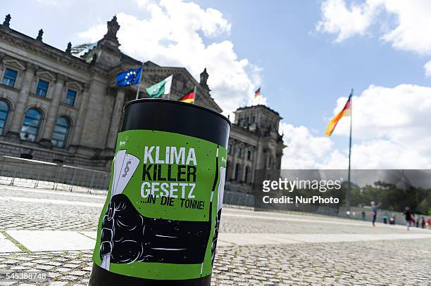 Totem by Association for the Environment and Nature Conservancy protest under the motto 'climate killer' in front of the Reichstag in Berlin,...