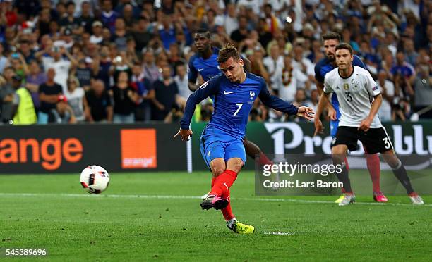 Antoine Griezmann of France converts the penalty to score the opening goal during the UEFA EURO semi final match between Germany and France at Stade...