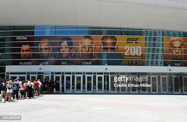 Banner featuring fighters for UFC 200 at T-Mobile Arena shows half of an image of mixed martial artist Daniel Cormier and a blank space where an...