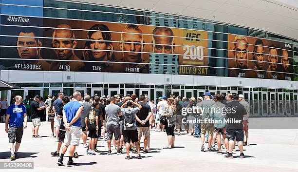 Banner featuring fighters for UFC 200 at T-Mobile Arena shows half of an image of mixed martial artist Daniel Cormier and a blank space where an...