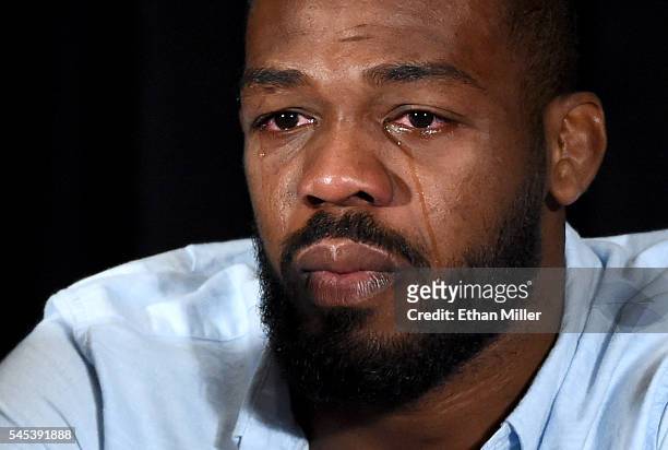 Mixed martial artist Jon Jones cries as he speaks during a news conference at MGM Grand Hotel & Casino to address being pulled from his light...