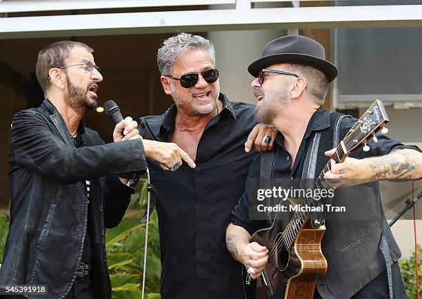 Ringo Starr, Jon Stevens and David A. Stewart perform onstage during the Ringo Starr Birthday Celebration held in front of the Capitol Records...