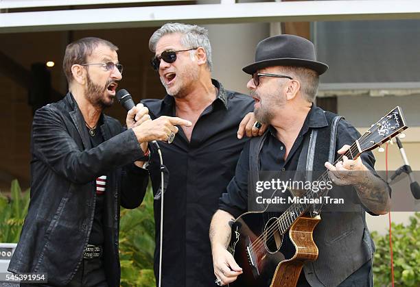 Ringo Starr, Jon Stevens and David A. Stewart perform onstage during the Ringo Starr Birthday Celebration held in front of the Capitol Records...