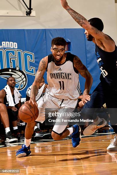 Devyn Marble of Orlando Magic Blue handles the ball during the game against the Dallas Mavericks during the 2016 NBA Orlando Summer League on July 7,...