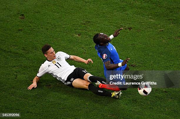 Moussa Sissoko of France is fouled by Julian Draxler of Germany during the UEFA EURO semi final match between Germany and France at Stade Velodrome...