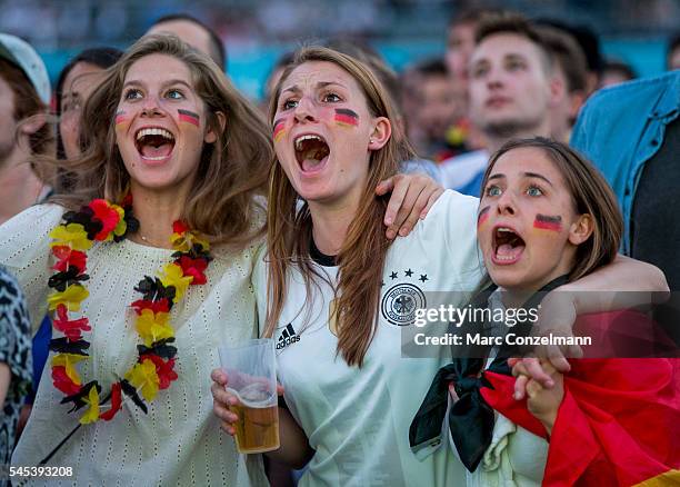 Supporters of the German national soccer team react during the UEFA EURO 2016 match between Germany and France at the public viewing area in the...