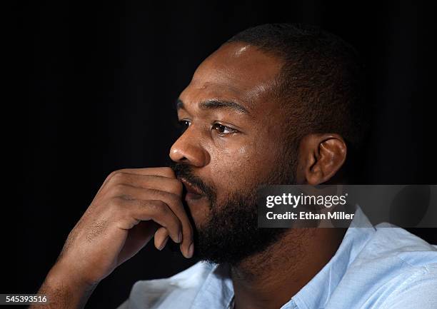 Mixed martial artist Jon Jones listens during a news conference at MGM Grand Hotel & Casino to address being pulled from his light heavyweight title...