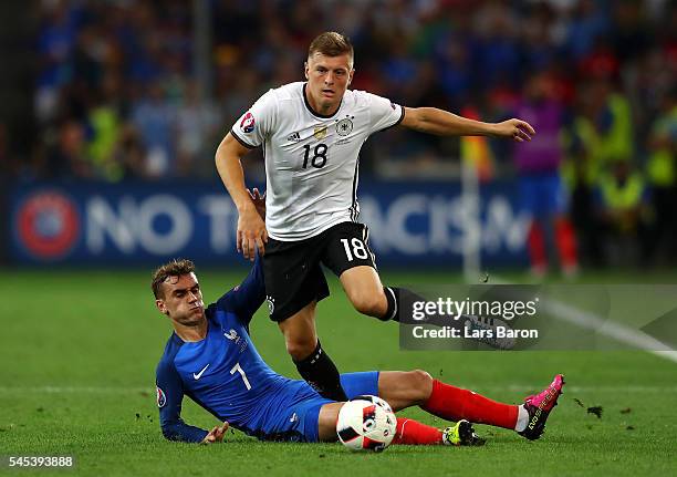 Toni Kroos of Germany is tackled by Antoine Griezmann of France during the UEFA EURO semi final match between Germany and France at Stade Velodrome...