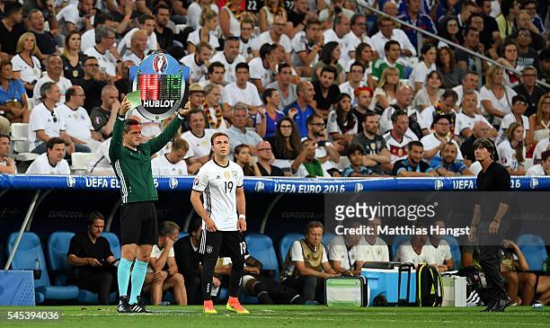 Mario Goetze of Germany prepares to come on as a substitute for the injured Jerome Boateng during the UEFA EURO semi final match between Germany and...