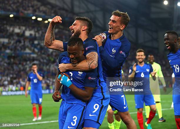 Patrice Evra, Olivier Giroud and Antoine Griezmannof France celebrate their team's 2-0 win in the UEFA EURO semi final match between Germany and...