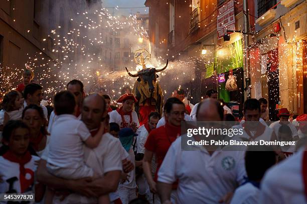 Toro del Fuego is run through the streets of Pamplona during the second day of the San Fermin Running of the Bulls festival on July 7, 2016 in...