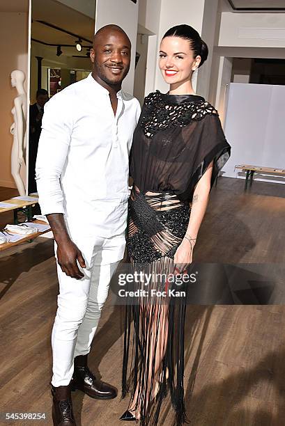 Julie Camara and rugbyman Djibril Camara attend the Dany Atrache Haute Couture Fall/Winter 2016-2017 show as part of Paris Fashion Week on July 4,...