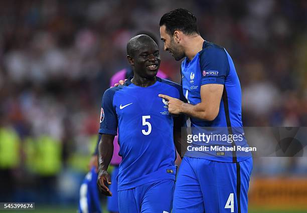 Adil Rami and N'Golo Kante of France celebrate after their team's 2-0 win in the UEFA EURO semi final match between Germany and France at Stade...