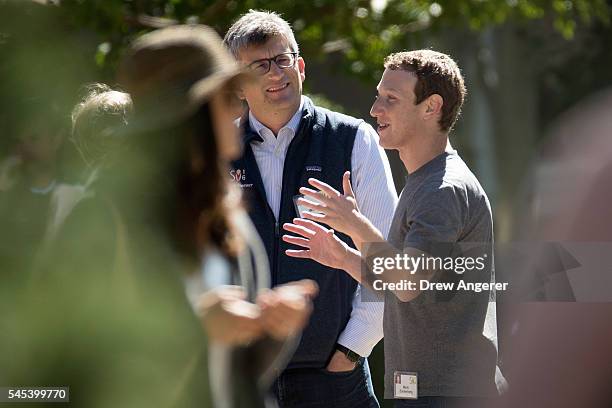 David Wehner, chief financial officer of Facebook, Inc., and Mark Zuckerberg, chief executive officer and co-founder of Facebook, Inc., speak with...