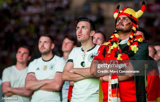 Supporters of the German national soccer team react during the UEFA EURO 2016 match between Germany and France at the public viewing area in the...