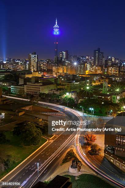 view of hillbrow tower & city skyline, johannesburg, gauteng province, south africa - long exposure light trails stock pictures, royalty-free photos & images