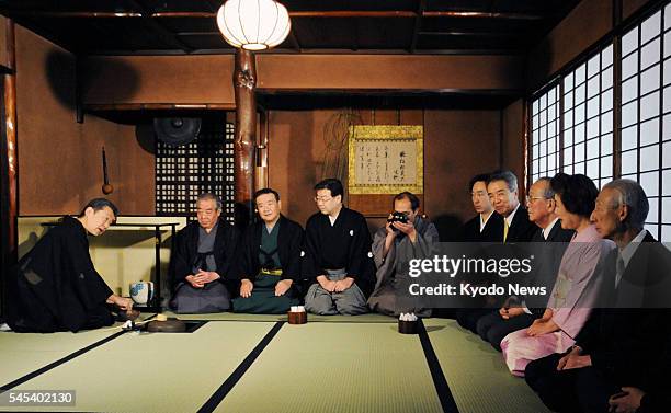 Japan - Sen Soshitsu , grand master of the Urasenke tea ceremony school, serves green tea to guests at the school's first tea ceremony gathering of...