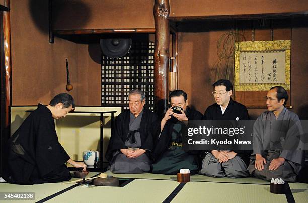 Japan - Sen Soshitsu , grand master of the Urasenke tea ceremony school, serves green tea to guests at the school's first tea ceremony gathering of...