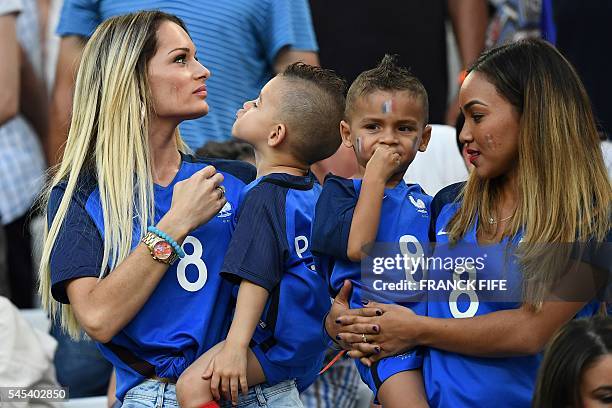 Ludivine Payet , the wife of France's forward Dimitri Payet, arrives for the start of the Euro 2016 semi-final football match between Germany and...