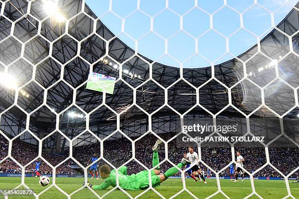 Germany's goalkeeper Manuel Neuer blocks a shot on goal during the Euro 2016 semi-final football match between Germany and France at the Stade...