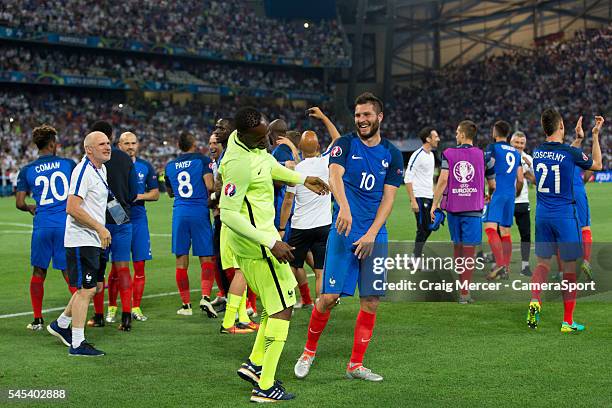 France's Andre-Pierre Gignac celebrates with team mates at full time during the UEFA Euro 2016 Semi-final match between Germany and France at Stade...