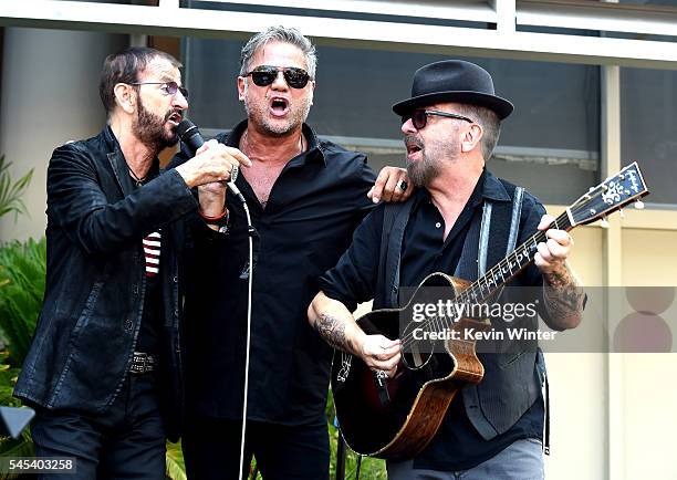 Musician Ringo Starr, singer Jon Stevens and musician Dave Stewart perform at Ringo Starr's "Peace & Love" birthday celebration at Capitol Records on...