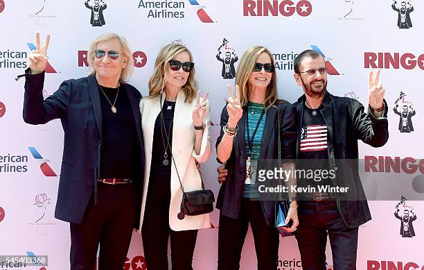 Musician Joe Walsh, his wife Marjorie Bach, her sister Barbara Bach and her husband musician Ringo Starr pose at Ringo Starr's "Peace & Love"...