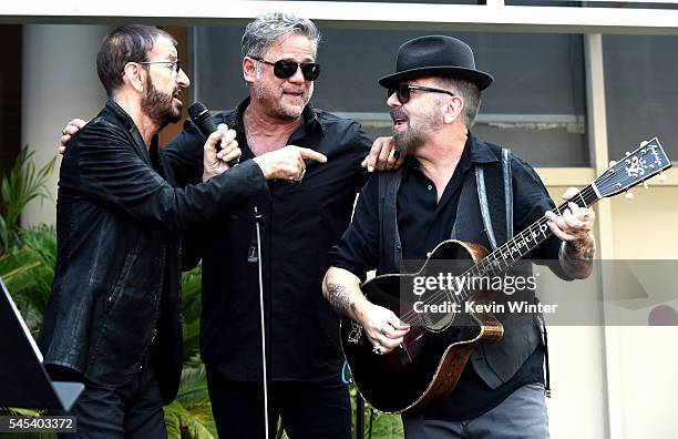 Musician Ringo Starr, singer Jon Stevens and musician Dave Stewart perform at Ringo Starr's "Peace & Love" birthday celebration at Capitol Records on...