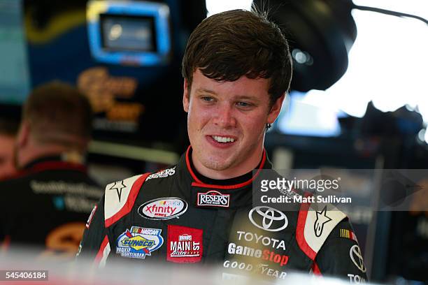 Erik Jones, driver of the Reser's Fine Foods Toyota, stands in the garage area during practice for the NASCAR XFINITY Series Alsco 300 at Kentucky...