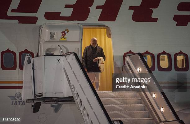 Indian Prime Minister Narendra Modi steps out of a plane upon his arrival at Air Force Base Waterkloof in Pretoria, South Africa on July 7, 2016.