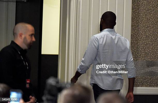 Mixed martial artist Jon Jones temporarily leaves a news conference at MGM Grand Hotel & Casino held to address his being pulled from his light...