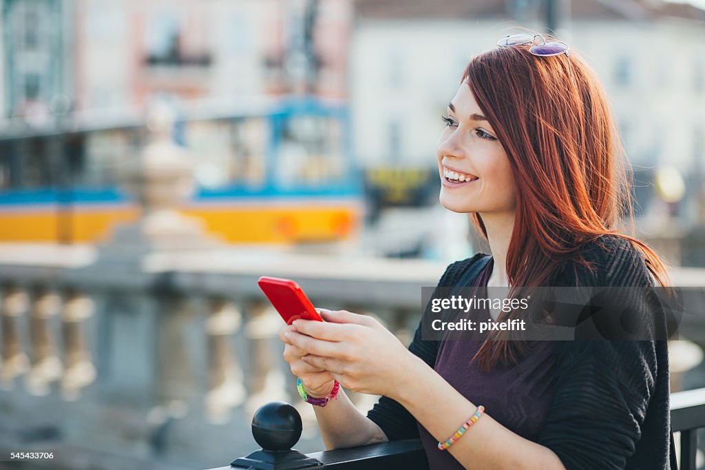 Serene girl with smart phone