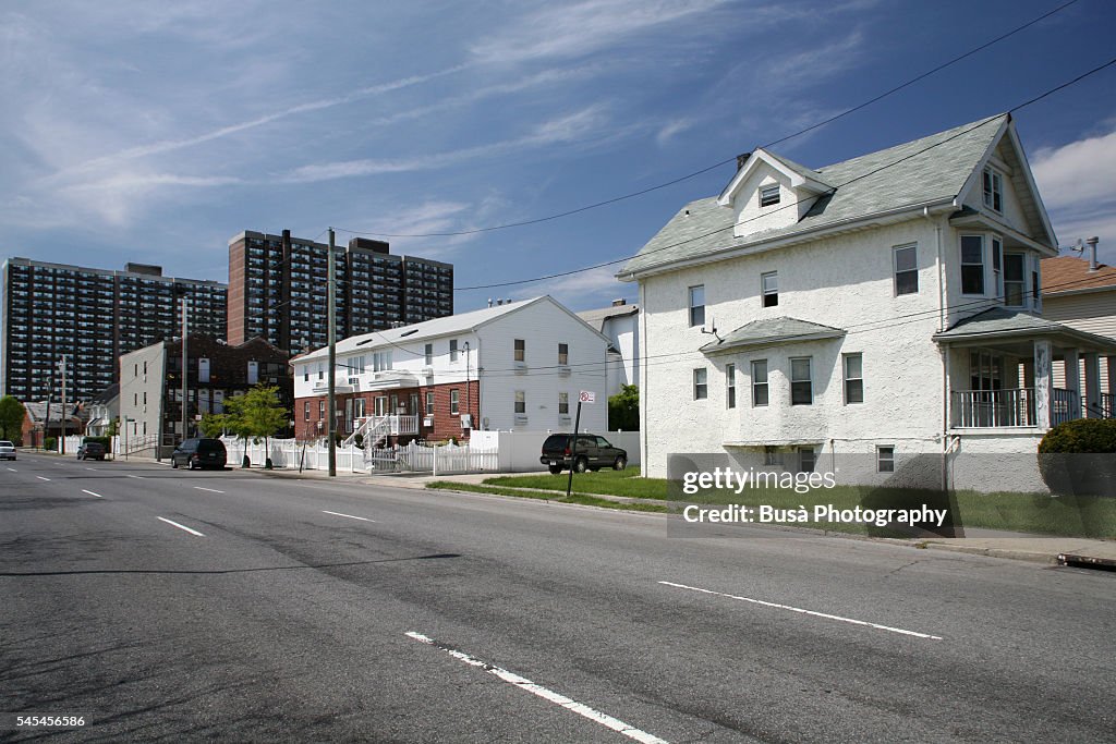 Middle-class single-family houses with public housing projects in the background the Rockaways, Queens, New York City