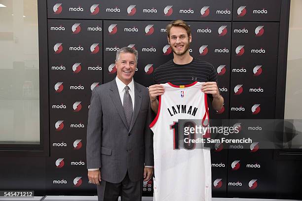 General Manager Neil Olshey and Jake Layman of the Portland Trail Blazers pose for a photo during Layman's media introduction July 7, 2016 at the...