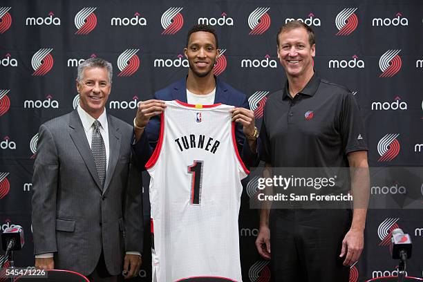 General Manager Neil Olshey, Evan Turner, and Head Coach Terry Stotts of the Portland Trail Blazers pose for a photo during Turner's media...