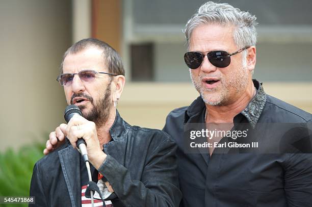 Musician Ringo Star and singer Jon Stevens perform at Ringo Starr's 'Peace and Love' birthday celebration on July 7, 2016 in Hollywood, California.