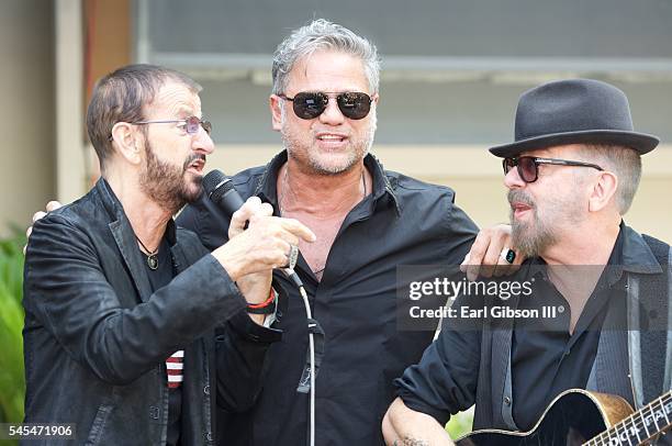Musician Ringo Starr, singer Jon Stevens and musician Dave Stewart perform at Ringo Starr's 'Peace and Love' birthday celebration at Capitol Records...
