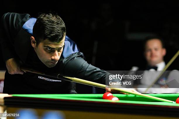 Michael Georgiou of England plays a shot against Shaun Murphy of England in second round match on day three of Indian Open 2016 at Hyderabad...