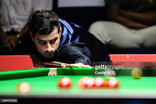 Michael Georgiou of England plays a shot against Shaun Murphy of England in second round match on day three of Indian Open 2016 at Hyderabad...