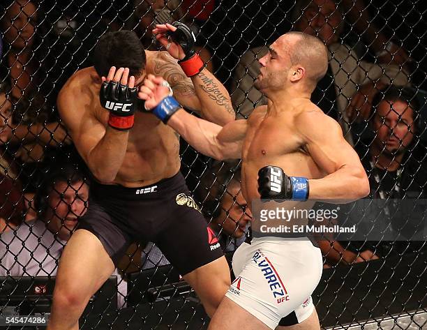 Eddie Alvarez punches Rafael Dos Anjos of Brazil during the UFC Fight Night event inside the MGM Grand Garden Arena on July 7, 2016 in Las Vegas,...