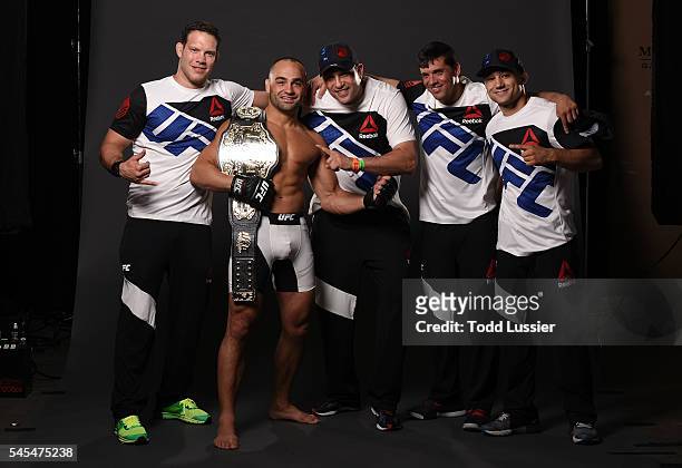 Newly crowned UFC lightweight champion Eddie Alvarez poses for a portrait backstage with his team after his victory over Rafael Dos Anjos of Brazil...