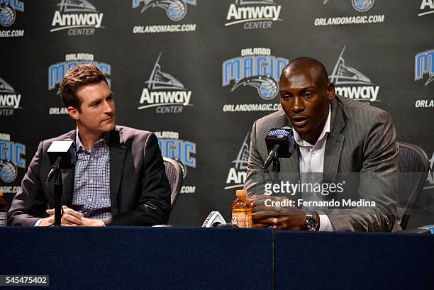 Orlando Magic general manager Rob Hennigan and head coach Frank Vogel introduce new Magic player Bismack Biyombo during a press conference on July 7,...