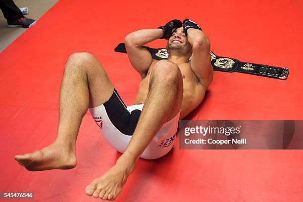 Eddie Alvarez celebrates in his locker room after defeating Rafael dos Anos and becoming the UFC lightweight champion during UFC Fight Night at MGM...