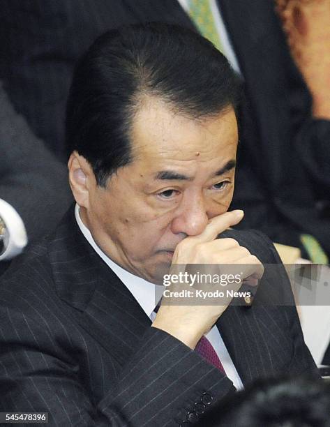 Japan - Prime Minister Naoto Kan attends a House of Councillors Budget Committee meeting in the Diet in Tokyo on March 7 the day after Foreign...