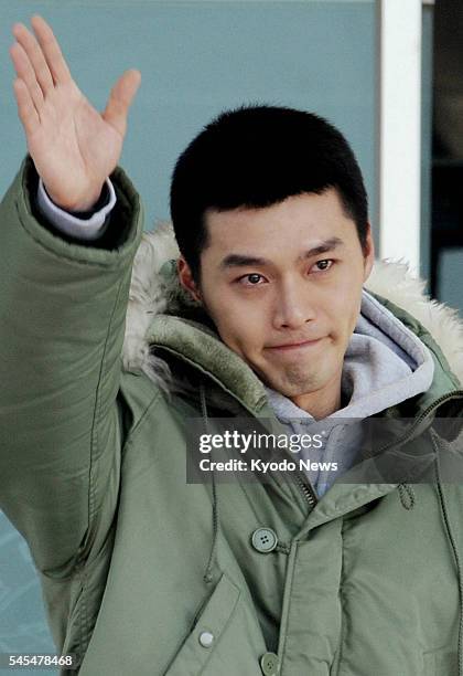 Pohang, South Korea - South Korean actor Hyun Bin waves to fans before checking in to a South Korean Marine training facility in Pohang, North...