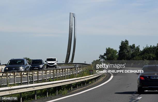 This picture taken on July 7, 2016 shows "Signe infini" , a 1993 monumental sculpture by French artist Marta Pan, located at the junction of A6 and...