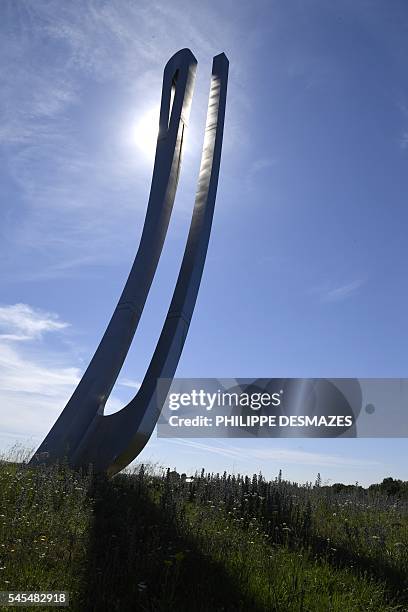 This picture taken on July 7, 2016 shows "Signe infini" , a 1993 monumental sculpture by French artist Marta Pan, located at the junction of A6 and...